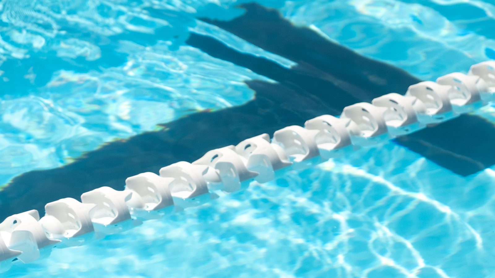 A closeup of water with a lane divider